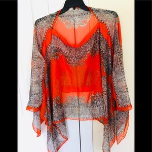 Shawl style blouse in hot orange and it’s one size
